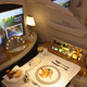 A meal lies served in a compartment in first class on board an Emirates A380 passenger plane.